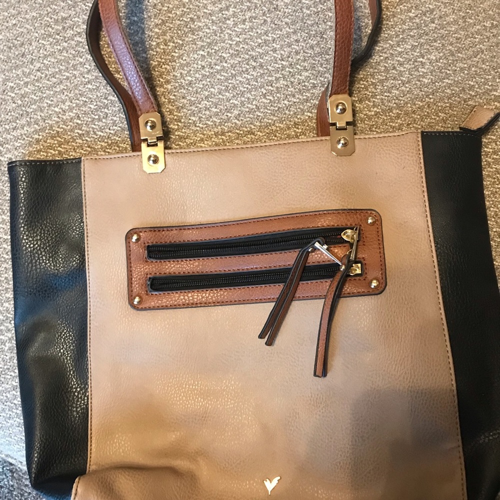 Large tote. Used showing signs of wear. See photos